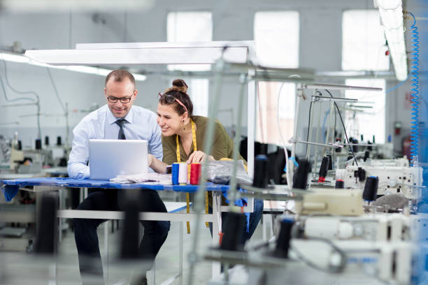 Bank manager and small business owner working with computer.